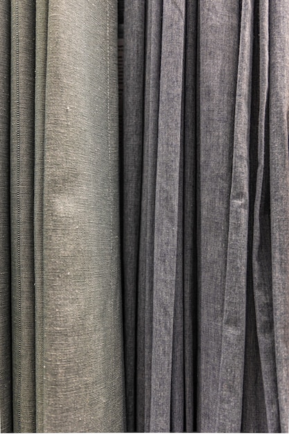 Set of grey dense fabrics of uniform texture, choice of materials in grey colors.