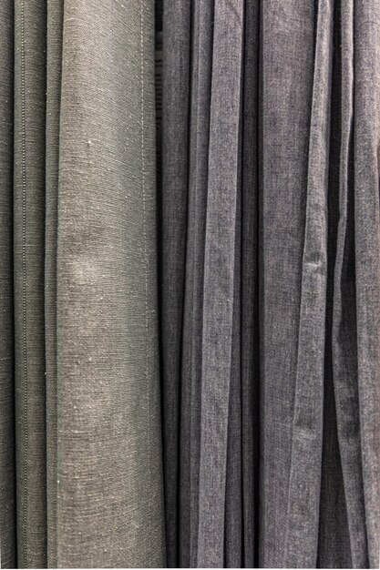 Set of grey dense fabrics of uniform texture, choice of materials in grey colors.