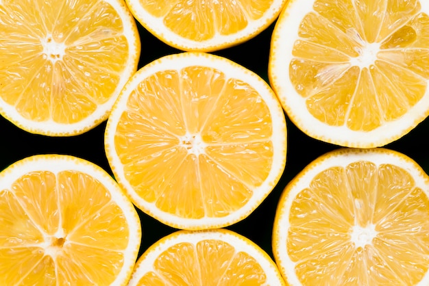 Free photo set of half of juicy exotic oranges on black background