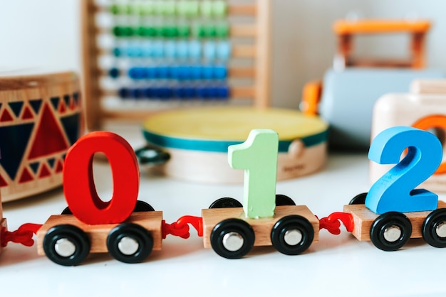 Set of kid toys on a white shelf