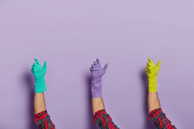 Set of male hands wear protective rubber gloves