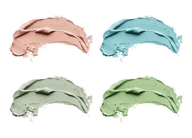 白い背景で隔離の化粧品泥マスク塗抹標本のセット。上面図、青、赤、緑の顔の粘土のクローズアップテクスチャ、コピースペース