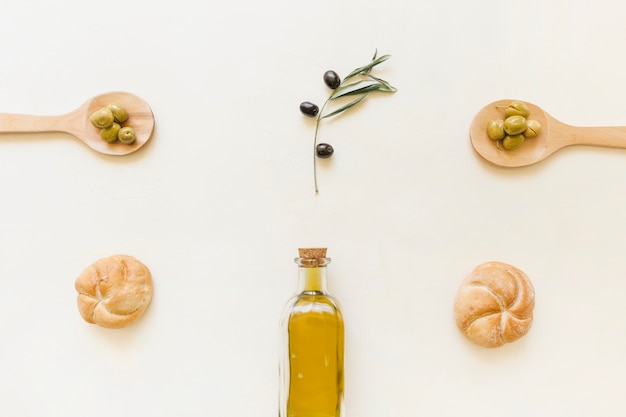 Set of olive oil bottle olives and bread 