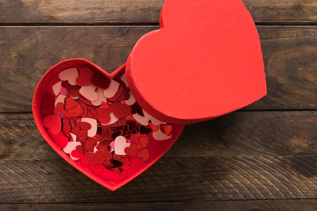 Set of ornament little colourful hearts in red present box