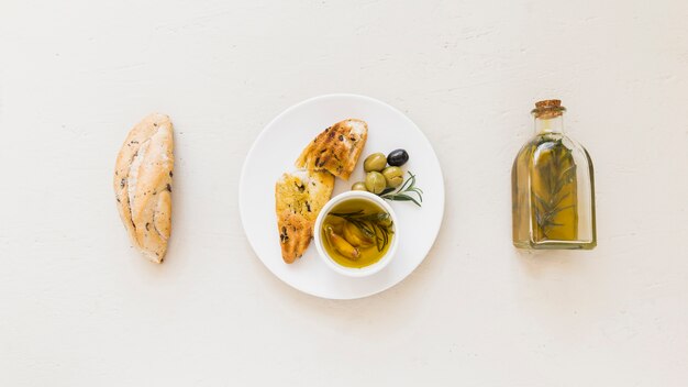 Set of plate with bread oil and olives