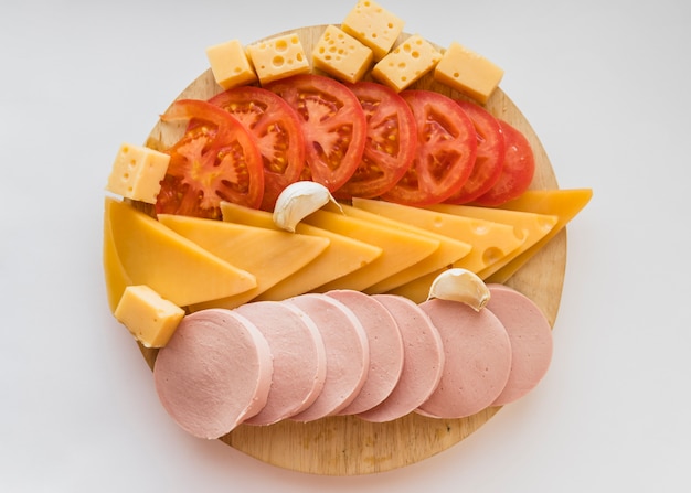 Set of snacks on wooden board