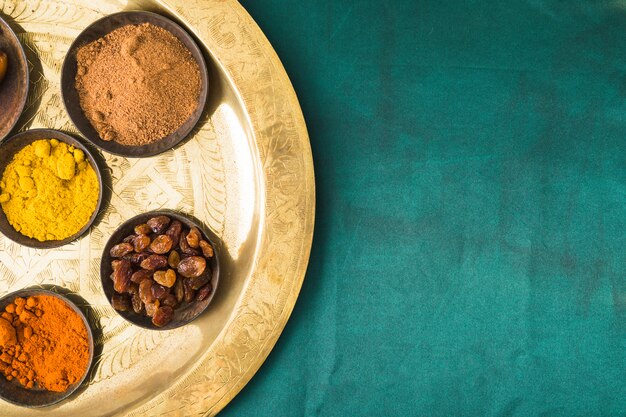 Set of spices and dry fruits on tray