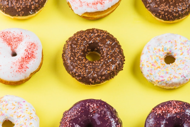 Set of tasty doughnuts with chocolate coating and sprinkles