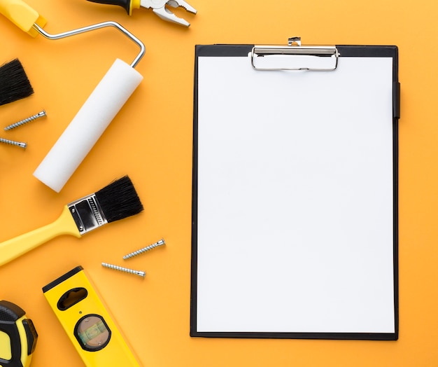 Free photo set of tools and empty clipboard with copy space