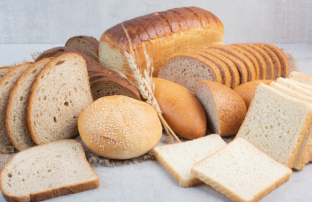 Set of various bread on stone surface