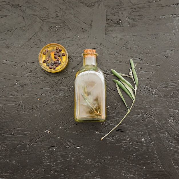 Free photo set with bottle of oil and plate