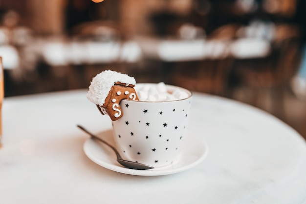 Set with white mug for mockup. The mug with the christmas decorations and cookie on edge