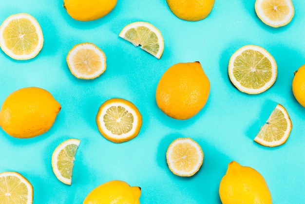 Free photo set of yellow lemons on blue background