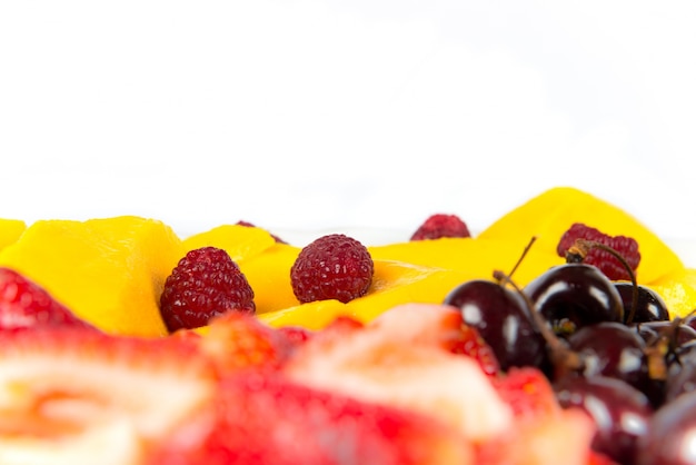 several colorful fruits over white background