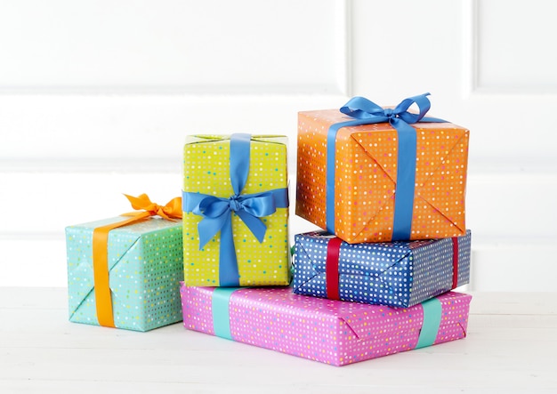 Several colorful gifts with bow