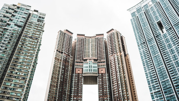 Free photo several curtain wall buildings under white sky