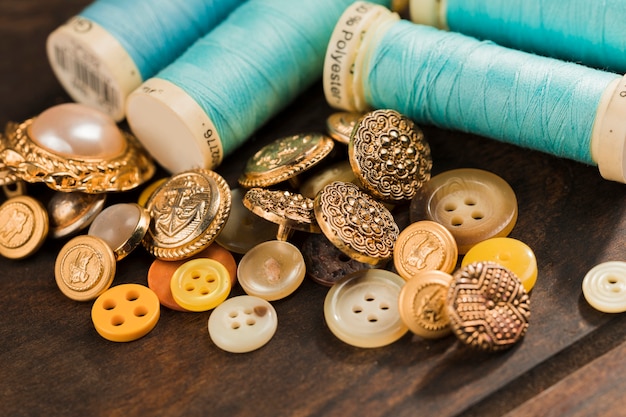 Free photo sewing buttons with thread reel