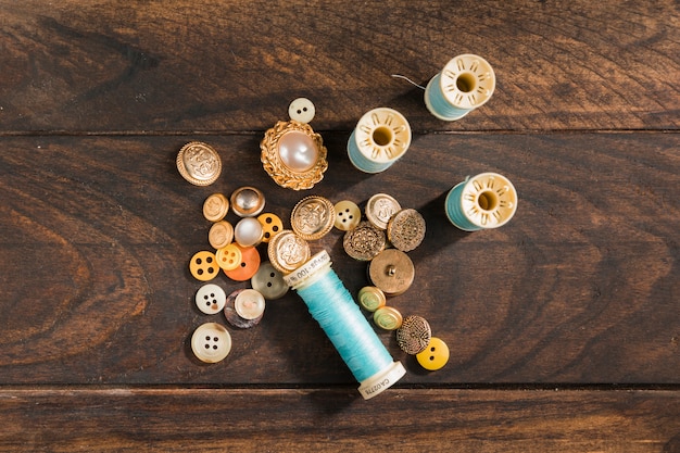 Free photo sewing buttons with thread reel