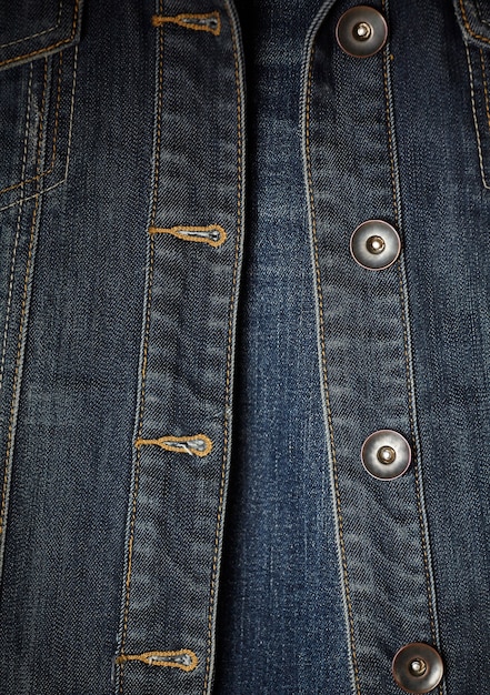 sewing denim jacket and buttons