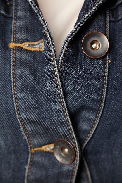 sewing denim jacket and buttons