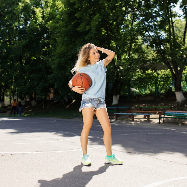 Sexy girl on the basketball court