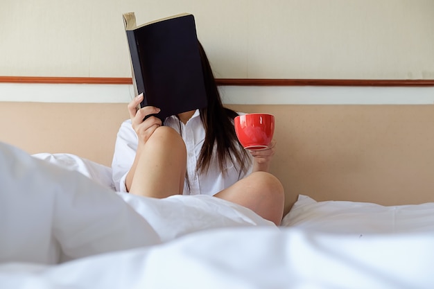 sexy-leaves-person-book-window-bed_1418-22.jpg