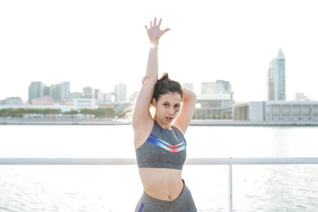 Sexy Pretty Sporty Girl Posing by City River