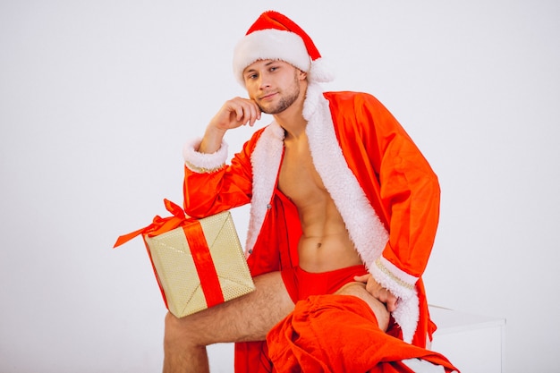 Free photo sexy santa man isolated on white background