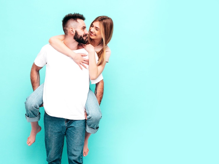 Free Photo sexy smiling beautiful woman and her handsome boyfriend happy cheerful family having tender moments in studiopure cheerful models huggingembracing each other cheerful and happy