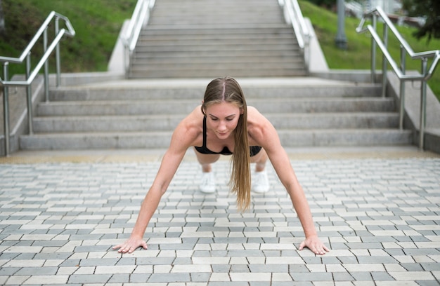 Sexy woman doing pushups