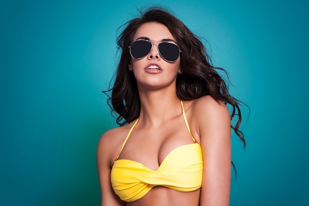 Sexy woman wearing fashion glasses in summer time