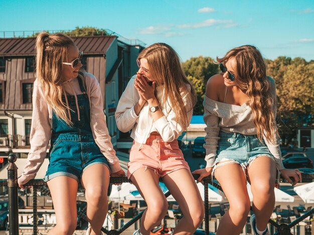 Sexy women sitting on handrail in the street They communicating and discussing something