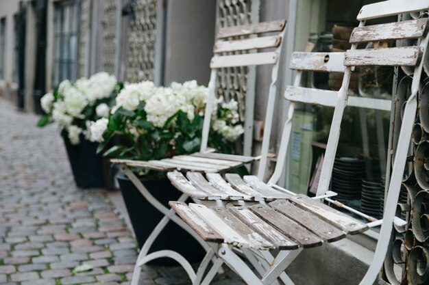 Shabby chairs outside of building