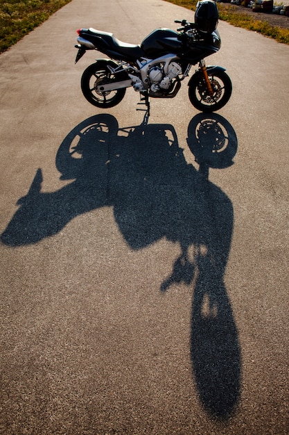 Shadow of motorbike in the sun
