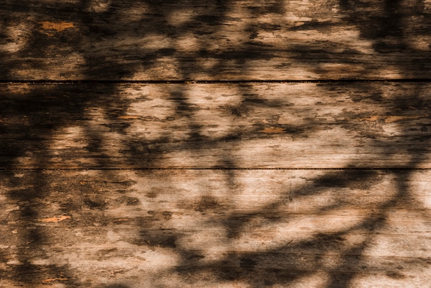 古い木製の背景上の影