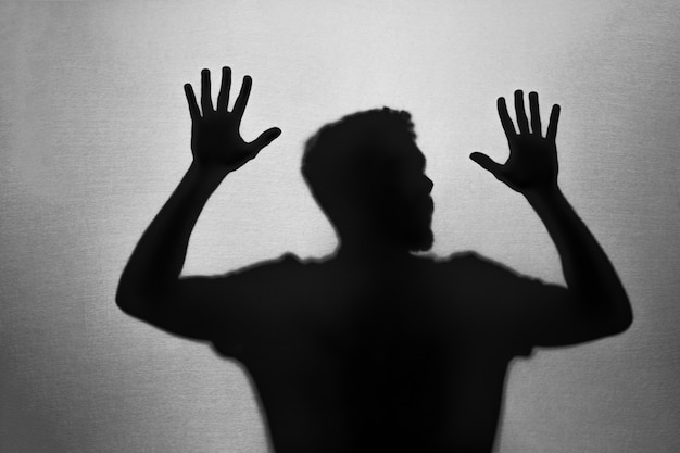 Free photo shadow of trapped male