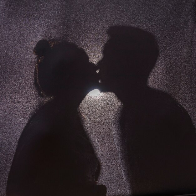 Shadows of cute kissing couple