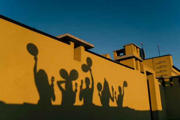 Shadows of people partying on the rooftop