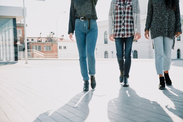 Shadows of three persons walking