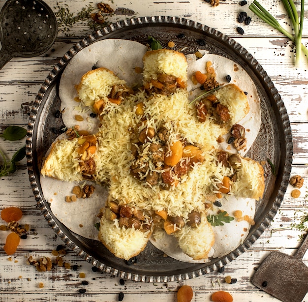 Shah pilaf traditional azerbaijani rice dish with dried fruits in crusty flatbread