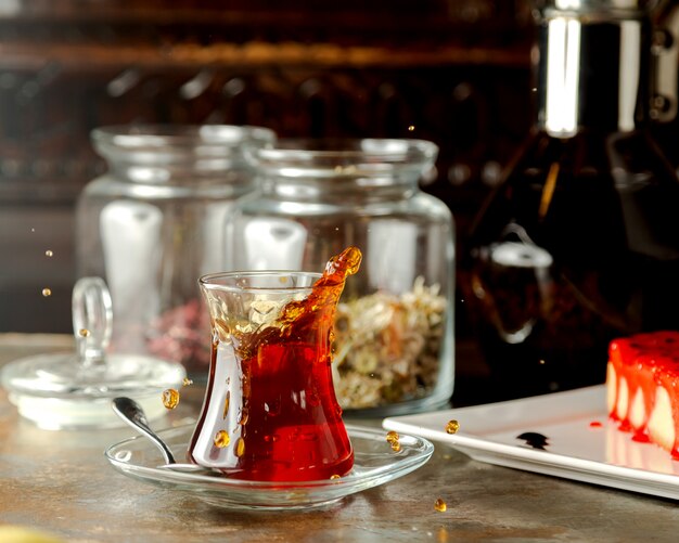 Shaken black tea glass in traditional azerbaijani pear shaped glass