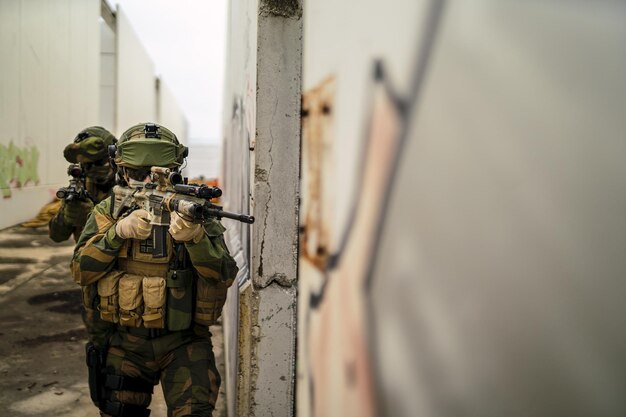 Shallow focus of a group of special force soldiers investigating an abandoned area