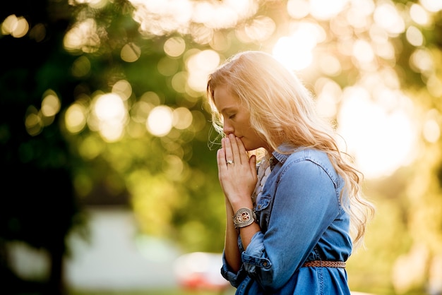 A shallow focus shot of a female praying