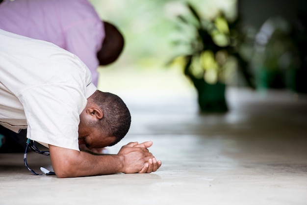 Free photo shallow focus shot of a male praying