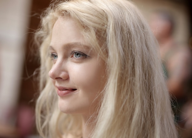 Free photo shallow focus of a young blonde female with blue eyes