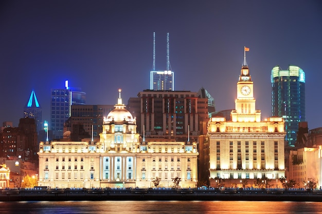 Shanghai historic architecture at night lit by lights over Huangpu River