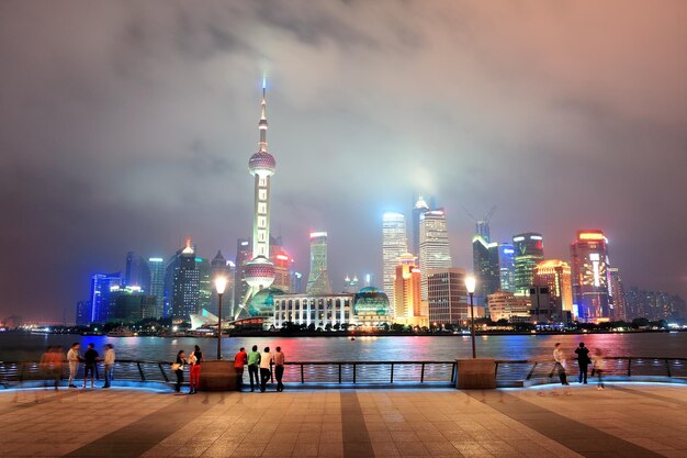 Shanghai urban city skyline over walkway at night