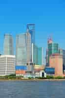 Free photo shanghai urban skyline with blue clear sky over huangpu river.