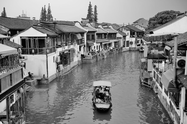 Shanghai Zhujiajiao town with historic buildings over river in black and white