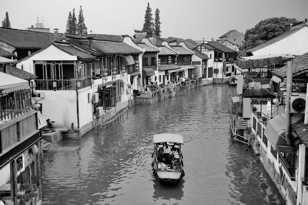 Shanghai Zhujiajiao town with historic buildings over river in black and white